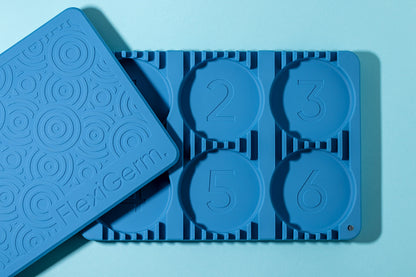 Blue silicone seed germination tray with 6 numbered pods