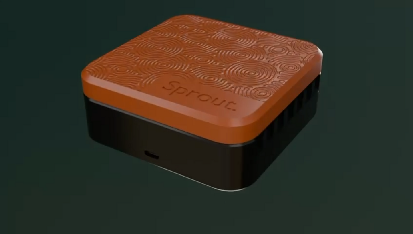 Orange and black silicone seed germination chamber facing left against a dark green background